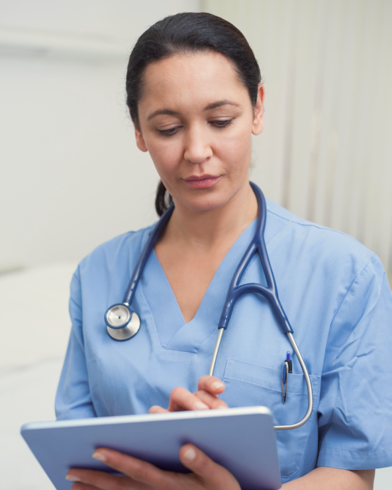 Clinician reviewing digital cognitive assessment results on an iPad